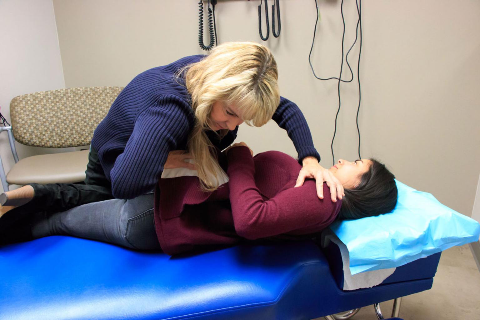 Chiropractor with patient